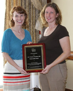 Photograph: Dr. Danesha Seth Carley (right) presenting plaque to Dr. Hannah Burrack (left) during awards luncheon at annual meeting of the Southeastern Branch of the Entomological Society of America in San Juan, Puerto Rico. Photograph by Rosemary Hallberg.