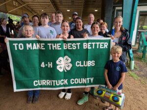 4-H Horse Show participants holding Currituck 4-H sign
