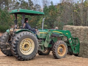 Skyler unloading a hay donation.